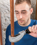 Man using Fast Acting Tubing Cutter 1/4 To 1-5/8 Inch For Copper, Brass, Aluminum And Plastic Tubing With Ergonomic XCEL Knob