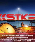 Beast Bright Telescoping Area Light with 8 Foot Extension and Removable Flashlight illuminating a campsite at dusk