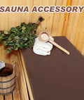 Waterproof Sauna Seat Cushion Mat 43x16 Inches Brown on sauna bench with towel and ladle, heat resistant high density foam pad visible.