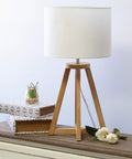 Interlocked Triangular Natural Wood Table Lamp With White Fabric Shade On Cord Easy Switch Sleek Modern Desk Light For Reading And Living Spaces Natural Wood Base Uses 40W Equivalent Bulb Not Included on a desk