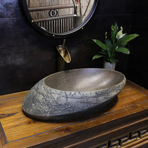 USZWBY Bathroom Sink Creativity Ceramic Vessel Sink Stone Texture Bathroom Sink with unique oval shape on wooden countertop.