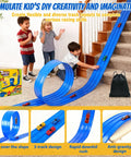 Kids playing with Epic 20 Ft Flexible Race Track Set For Kids With 3 Lane Ramp 6 Race Cars Suction Cups Rolls Up Portable DIY Anti Gravity Car Track Toy Blue Easy Storage And Travel Friendly Kid Tested Easy Setup For Busy Parents on stairs.