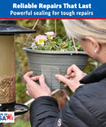 Person applying Clear Butyl Seal Tape 4 x 5 Ft Waterproof Leak Repair Tape For Roofs Gutters Pipes And RVs Heavy Duty Flexible Weatherproof Made In USA to a hanging plant pot.
