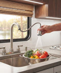 Two Handle Pull Down Kitchen Sink Faucet With Sprayer And Stream Spray Toggle in use washing vegetables in RV kitchen