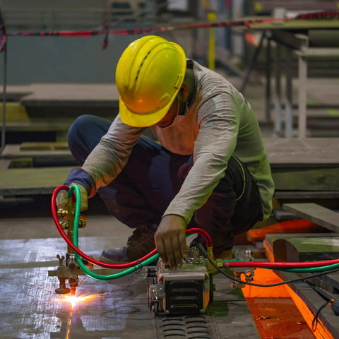 Worker using Oxy Acetylene Welding Hose 50 Feet Long With One Quarter Inch Inner Diameter And B Fitting Twin Cutting Torch