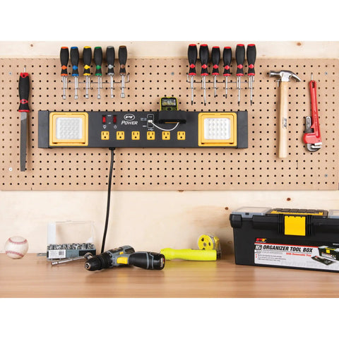 Heavy Duty Commercial Grade Power Station With Six Outlets And Two USB Ports Built In Cradle And Pivoting 1000 Lumen LED Lights Ideal For Garages, Workshops, And Job Sites installed on a workshop pegboard wall.