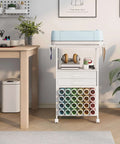 VENNQD white rolling storage cart with 24 vinyl roll holders, two fabric drawers, accessories holder, and a Cricut on top
