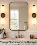 govahb 2-Light Hardwired Wall Sconces, Vintage Wall Sconce Milk Glass illuminated above a bathroom mirror with bronze accents.