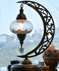 Turkish Clear Glass Moon Shape Table Lamp, Vintage Crescent Boho Chic Desk Light for Rustic Living Rooms, featuring crackle glass.