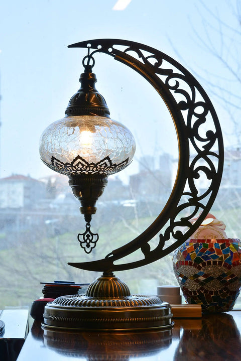 Turkish Clear Glass Moon Shape Table Lamp, Vintage Crescent Boho Chic Desk Light for Rustic Living Rooms, featuring crackle glass.