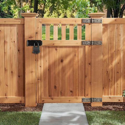 4 Inch Stainless Steel Hasp Latch With Padlock Keys And Screws on a wooden gate outdoors, secured with a heavy duty black waterproof gate lock.