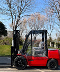 Red forklift with All Weather Forklift Cab Enclosure Cover With Heavy Duty UV Protection And Waterproof Vinyl Universal Fit