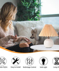 Pleated Ceramic Table Lamp With Tricolor Led Bulb For Living Room Decor on table near woman and dog, cozy setting