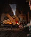 Person lighting wood in fireplace using Real Wood Pellet Fire Starter Pack 10 Count For Smokeless Outdoor Fire Pits And Indoor Fireplaces Easy Lighting
