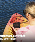 Woman kayaking with a Palm Sized Ultra Portable Waterproof And Drop Proof Bluetooth Speaker With Deep Bass, Ambient Edge Lighting.