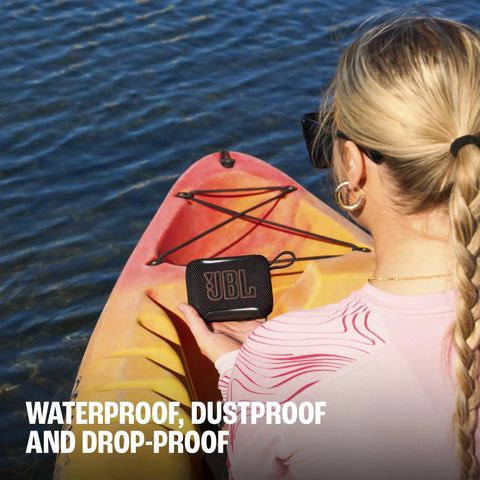 Woman kayaking with a Palm Sized Ultra Portable Waterproof And Drop Proof Bluetooth Speaker With Deep Bass, Ambient Edge Lighting.