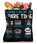 Black canvas tote bag with dragon boating text, filled with groceries and flowers, Paddler Tote Bag For Dragonboating Enthusiasts And Racing Crew.