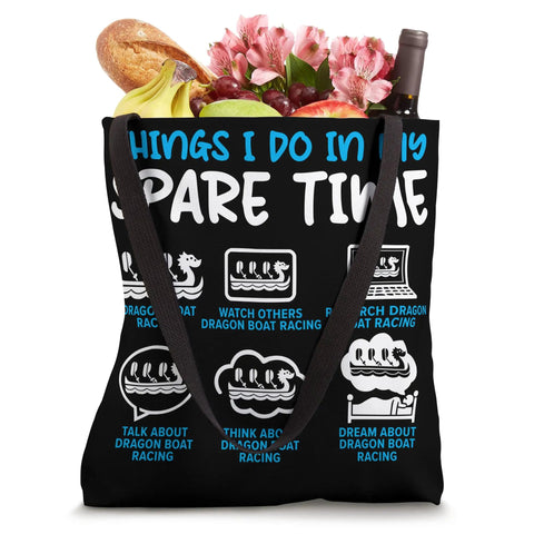 Black canvas tote bag with dragon boating text, filled with groceries and flowers, Paddler Tote Bag For Dragonboating Enthusiasts And Racing Crew.