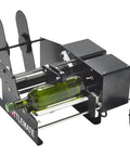 Heavy Duty Automatic Bottle Label Applicator Machine For Cylinders applying a label on a green wine bottle.