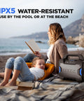 Tailgater Boom Outdoor Portable Bluetooth Speaker With Mic In FM Radio USB Port Battery IPX5 Water Resistant shown on beach