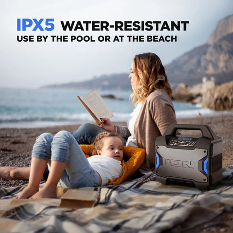 Tailgater Boom Outdoor Portable Bluetooth Speaker With Mic In FM Radio USB Port Battery IPX5 Water Resistant shown on beach