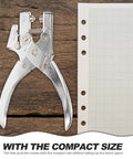 Handheld Metal Hole Puncher For Office And Crafts next to lined paper, showcasing compact design and titanium alloy material.