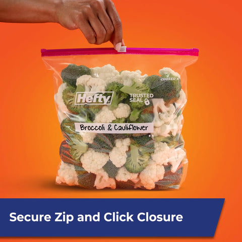 Gallon Slider Storage Bags Set Of 66 filled with broccoli and cauliflower, secure zip closure, writable label on clear bag held by hand.