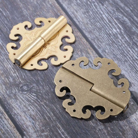 Two Piece Brass Flower Cloud Hinge Set For Jewelry Boxes And Furniture Decor With Screws 60 By 55mm shown on wood surface