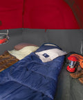 Brazos 20 To 30 Degree Fahrenheit Adult Cool Weather Sleeping Bag in blue inside a red tent with camping gear visible