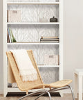 Room with a bookshelf and rattan chair against Treetops Peel And Stick Wallpaper In White And Off White, Removable Wall Covering