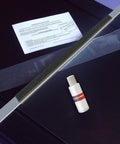 Patented Treadmill Lubrication System With 24 Inch Applicator Wand and bottle on black surface, Made In USA Since 1998