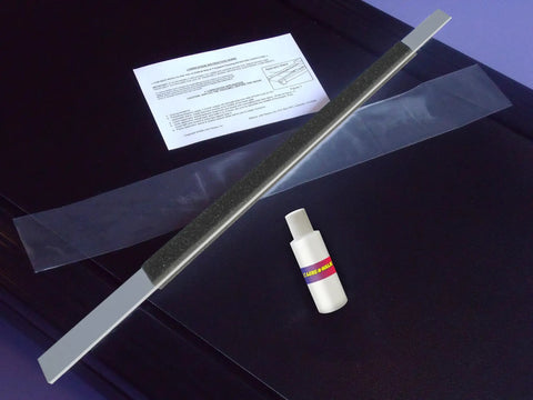 Patented Treadmill Lubrication System With 24 Inch Applicator Wand and bottle on black surface, Made In USA Since 1998