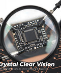 Zoomed view of PCB through 5X magnifier showing details of All-in-One Soldering Stand With Four Handy Helping Hands And 5X Magnifier.