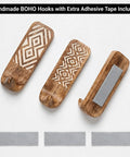 Top Tier Boho Wood Peel And Stick Wall Hooks Featuring A Seriously Strong Adhesive Grip, showing three handcrafted hooks with adhesive.