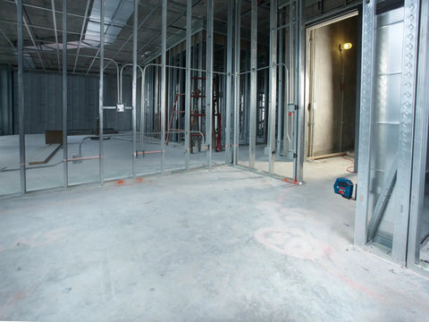 GLL 55 Self Leveling Cross Line Laser with Visimax Technology on construction site for precise alignment and bright visibility