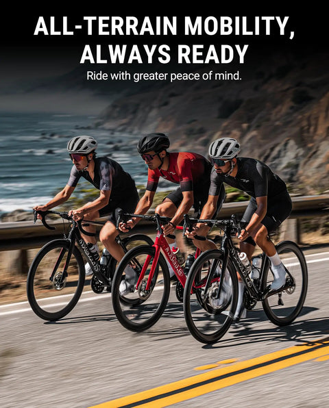 Three cyclists on a coastal road emphasizing the Two Pack Road Bike Tire Liner For Flat Protection and all-terrain readiness.