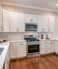 Modern kitchen with 25 Pack Brushed Satin Nickel 3 Inch Cabinet Pulls, 76mm Hole Centers, Dope Kitchen Cabinet Hardware on white cabinets.