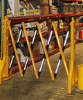 8 Ft Folding Traffic Barrier Fence With Reflectors, Portable Construction Barricade in warehouse setting, partially expanded