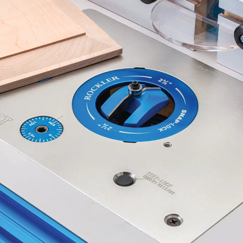 Close-up of locking router plate insert kit with twist locks for router table, aluminum construction, dust control features.