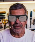 Built Dog Gone Tough 6-Pack Welding Goggles Featuring Auto Darkening Lenses For Serious Shop Work snugly fitting a man in a workshop.