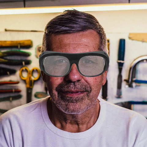 Built Dog Gone Tough 6-Pack Welding Goggles Featuring Auto Darkening Lenses For Serious Shop Work snugly fitting a man in a workshop.