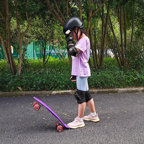 Youth wearing Knee Pads Elbow Pads And Wrist Guards Full Protective Gear For Skateboarding displaying durability and safety features.