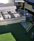 Heavy Duty Drawer Slides With Lock One Pair Of Ball Bearing Tracks installed in a stainless steel kitchen setup with sink and stove.