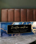 Personalized Acrylic Desk Plate With Your Name In Blue Coast Finish on marble table, elegant custom nameplate