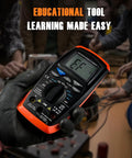 Gloved hand holding Digital Multimeter Voltage Tester 2000 Counts For ACDC Voltage amid educational setting