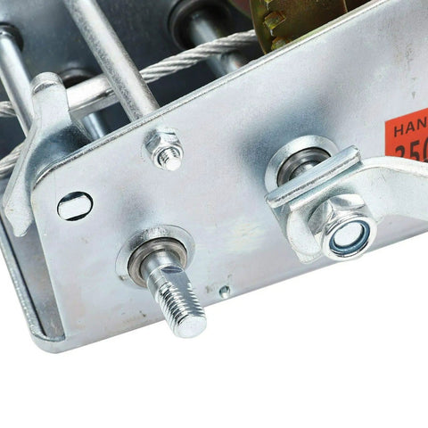 Close-up of 600 Lb Hand Winch with 26.3 Ft Steel Cable, showing metal gear and bolts in heavy-duty construction.