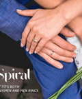 Hands of a couple showing rings, highlighting Invisible Silicone Ring Size Adjusters Kit With Four Size Options, 12 Pack.