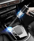 Hand using 3 In 1 Cordless Handheld Vacuum And Air Duster, 12000Pa High Power Mini Cleaner in car interior for quick cleanup.