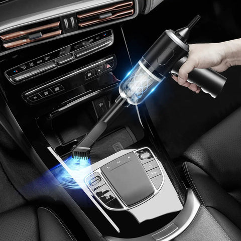 Hand using 3 In 1 Cordless Handheld Vacuum And Air Duster, 12000Pa High Power Mini Cleaner in car interior for quick cleanup.