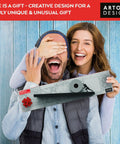 Couple holds Sisyphus Black Floating Toilet Paper Shelf Organizer For Bathroom Wall Mount Tilted Holder, smiling in excitement.